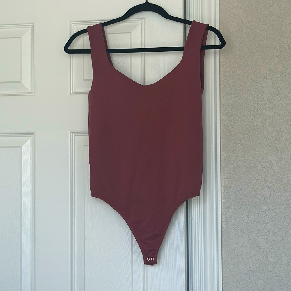 Free People Body Suit . M/L .  Pinkish Maroon Color